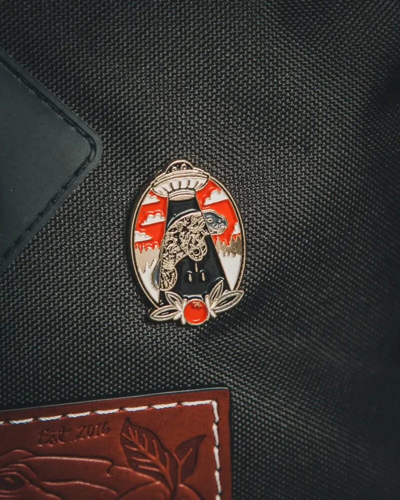 Manatee Abduction Enamel Pin